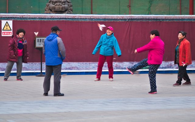 Beijing Street Scene, Chinese Playing Ball In A Park